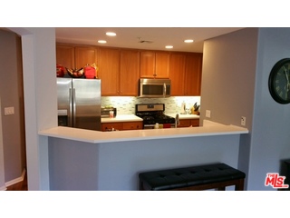 12963 West Runway Road, Unit 221 Playa Vista, CA 90094 - Photo 3 of 20 a kitchen with a sink cabinets and stainless steel appliances