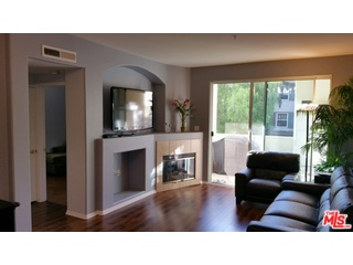 12963 West Runway Road, Unit 221 Playa Vista, CA 90094 - Photo 5 of 20 a living room with furniture and a fireplace