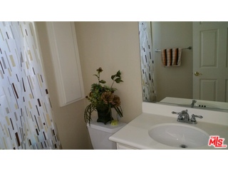 12963 West Runway Road, Unit 221 Playa Vista, CA 90094 - Photo 9 of 20 a bathroom with a sink and mirror