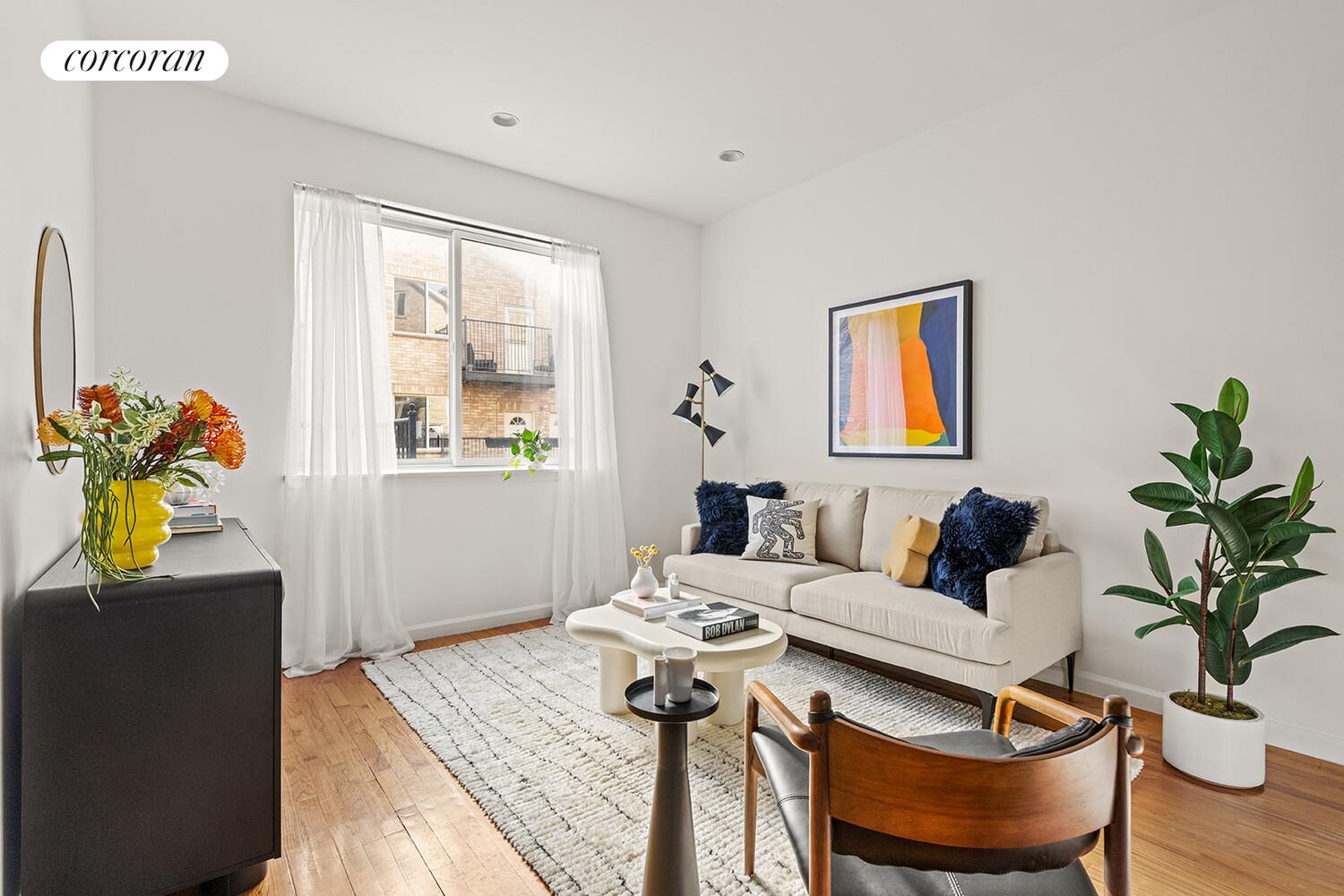 963 Kent Avenue, Unit D2 Brooklyn, NY 11205 - Photo 2 of 9 a living room with furniture and a window