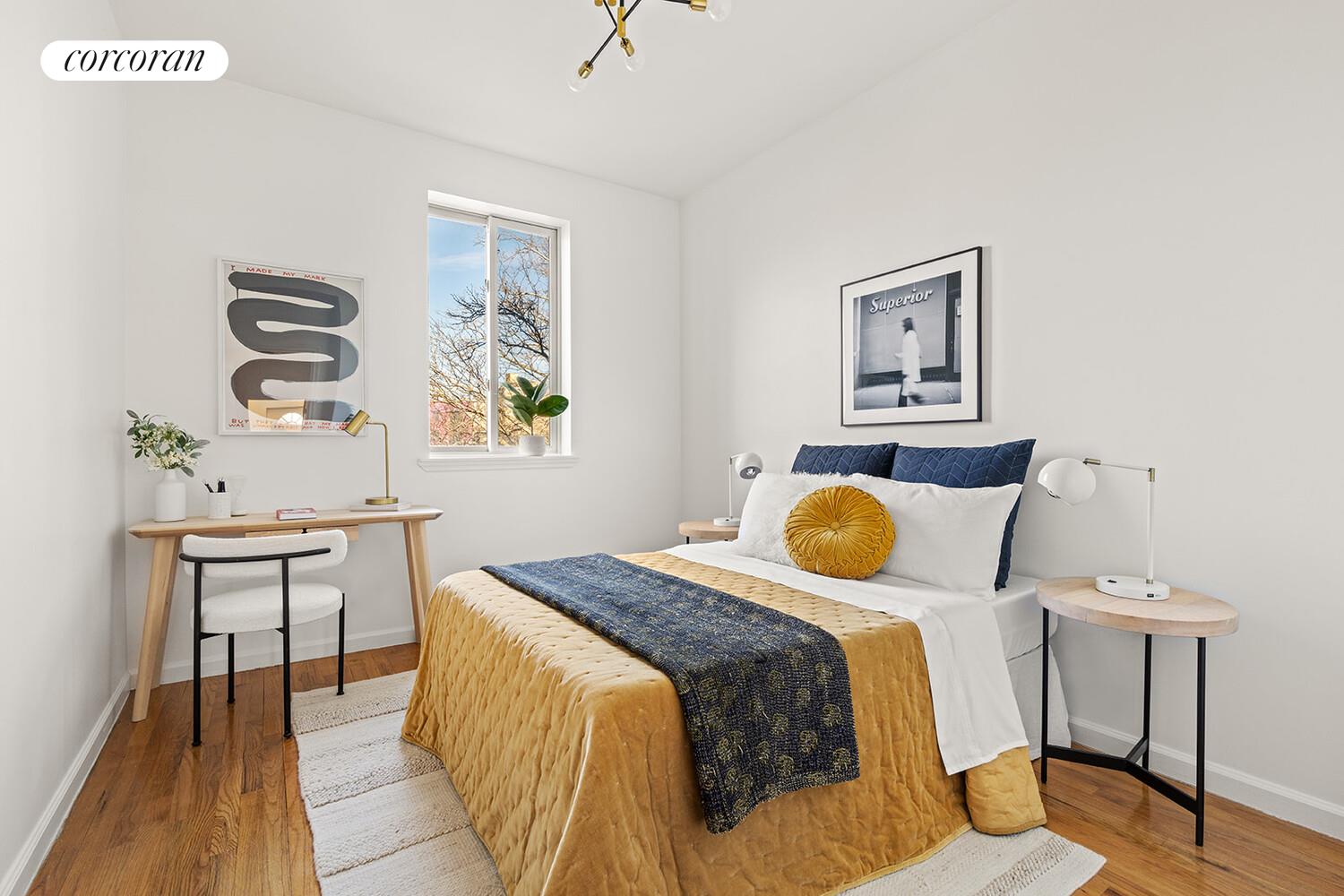 963 Kent Avenue, Unit D2 Brooklyn, NY 11205 - Photo 5 of 9 a bedroom with a bed and a table