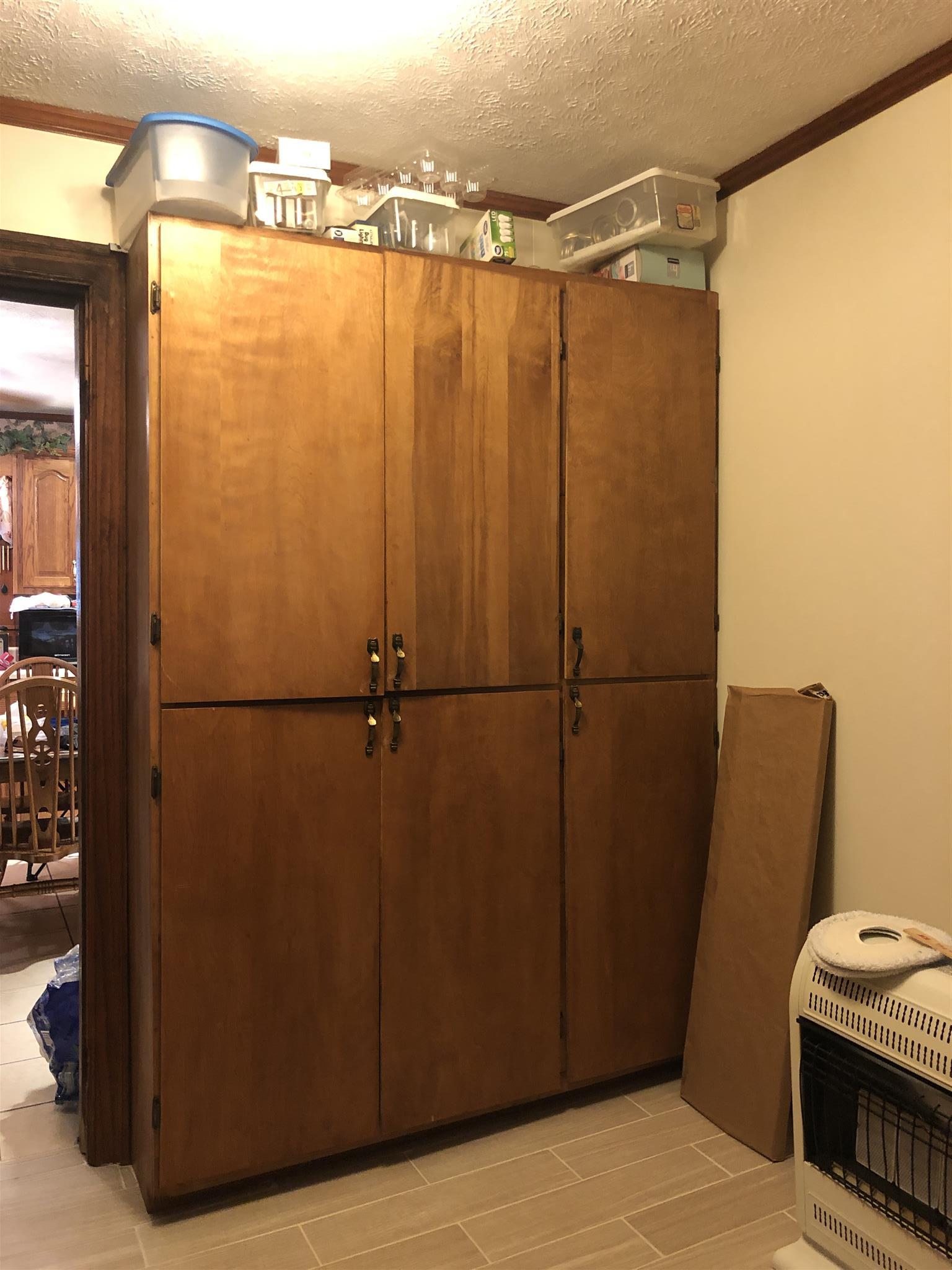 739 Winklers Road Red Boiling Springs, TN 37150 - Photo 17 of 20 Large Pantry Cabinet in Utility room also stays