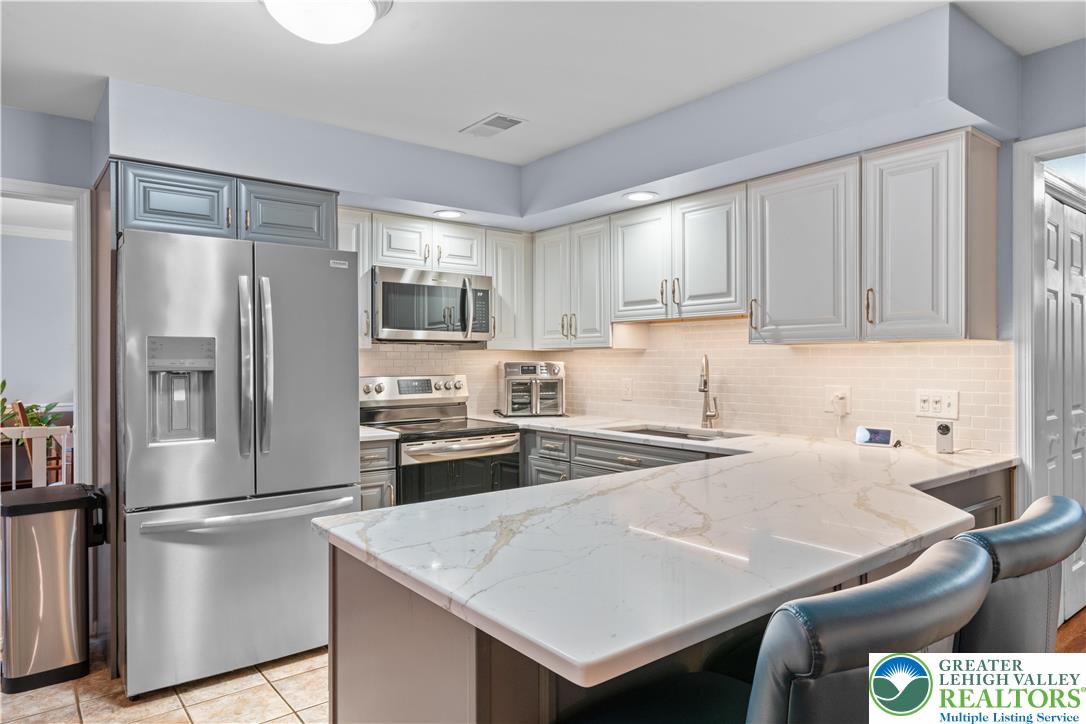 2702 Northampton Street Bethlehem, PA 18020 - Photo 15 of 51 a kitchen with a refrigerator a stove a sink and a refrigerator