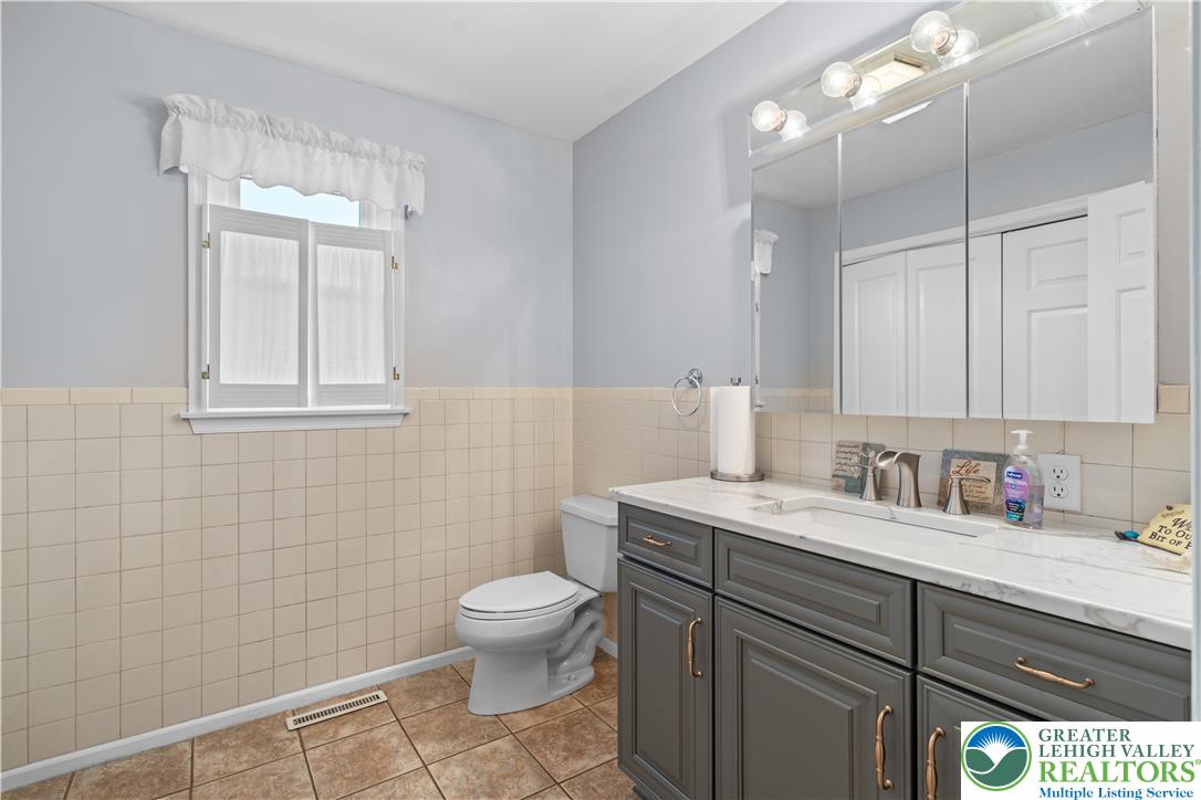 2702 Northampton Street Bethlehem, PA 18020 - Photo 23 of 51 a bathroom with a sink a toilet and mirror