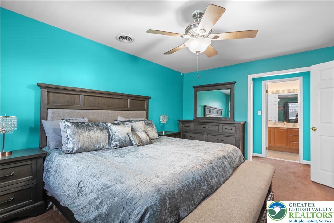 2702 Northampton Street Bethlehem, PA 18020 - Photo 25 of 51 a bedroom with a large bed and a chandelier
