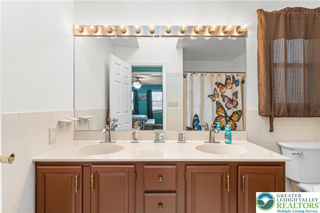 2702 Northampton Street Bethlehem, PA 18020 - Photo 30 of 51 a bathroom with a sink and a mirror