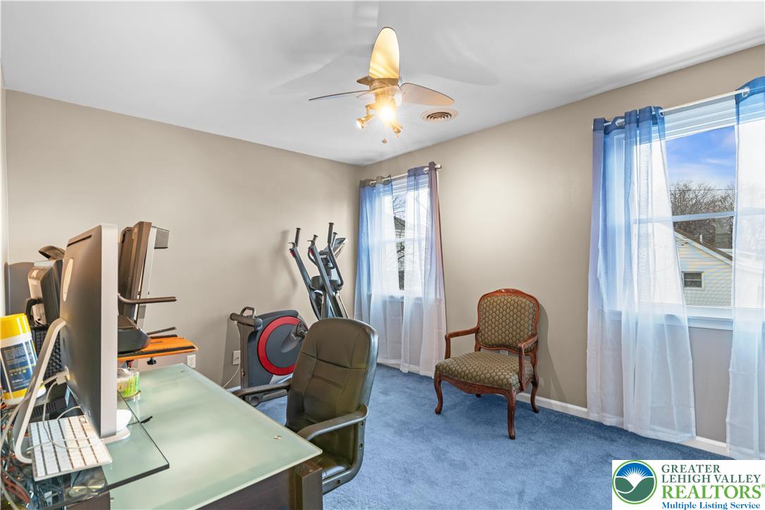 2702 Northampton Street Bethlehem, PA 18020 - Photo 32 of 51 a living room with furniture a chandelier and a window