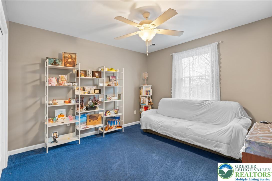 2702 Northampton Street Bethlehem, PA 18020 - Photo 35 of 51 a bed room with a bed and a book shelf