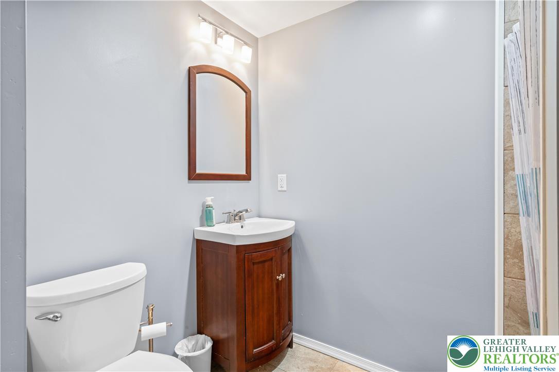 2702 Northampton Street Bethlehem, PA 18020 - Photo 43 of 51 a bathroom with a toilet sink and mirror