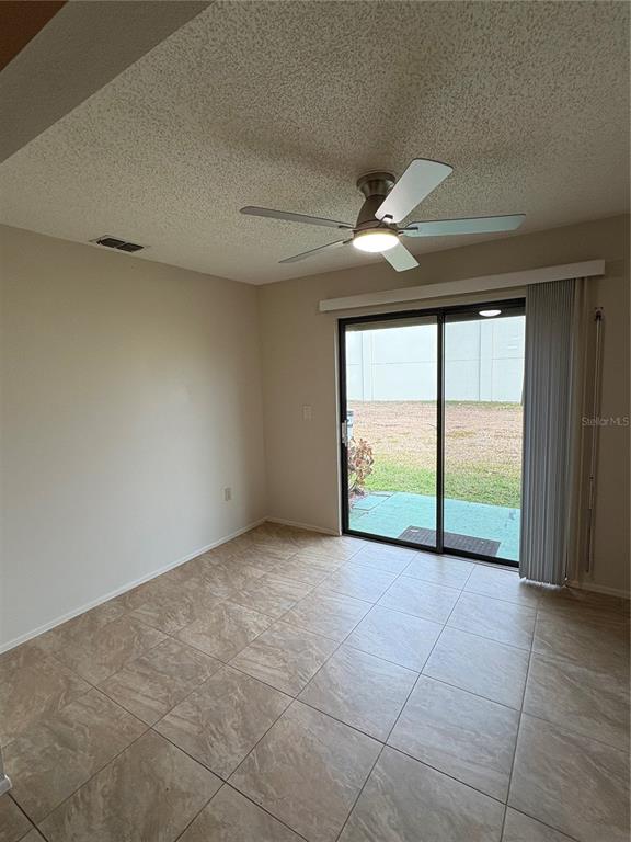 13250 Ridge Road, Unit 16 Largo, FL 33778 - Photo 16 of 32 a view of an empty room with a window