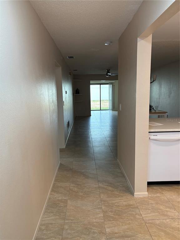 13250 Ridge Road, Unit 16 Largo, FL 33778 - Photo 2 of 28 a view of a hallway with entryway