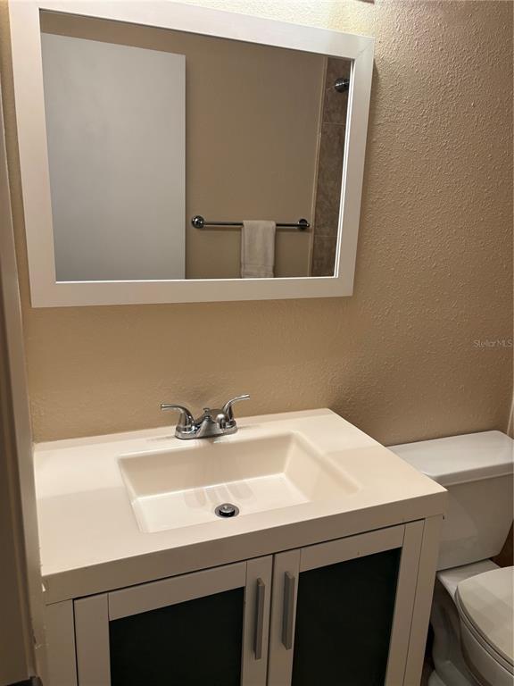 13250 Ridge Road, Unit 16 Largo, FL 33778 - Photo 22 of 28 a bathroom with a sink and a mirror