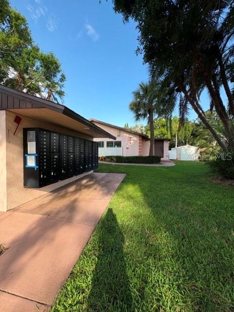 13250 Ridge Road, Unit 16 Largo, FL 33778 - Photo 24 of 28 a view of a house with a yard