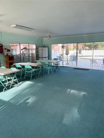 a view of a chairs and table in a room