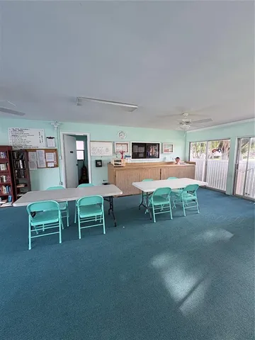 a view of a livingroom with furniture and windows
