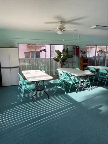 a view of a patio with a table and chairs