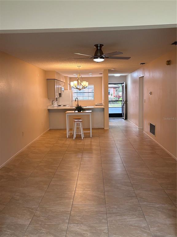 13250 Ridge Road, Unit 16 Largo, FL 33778 - Photo 9 of 28 a view of a room with furniture and window