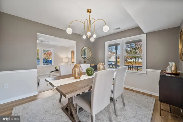 a bedroom with furniture and a wooden floor