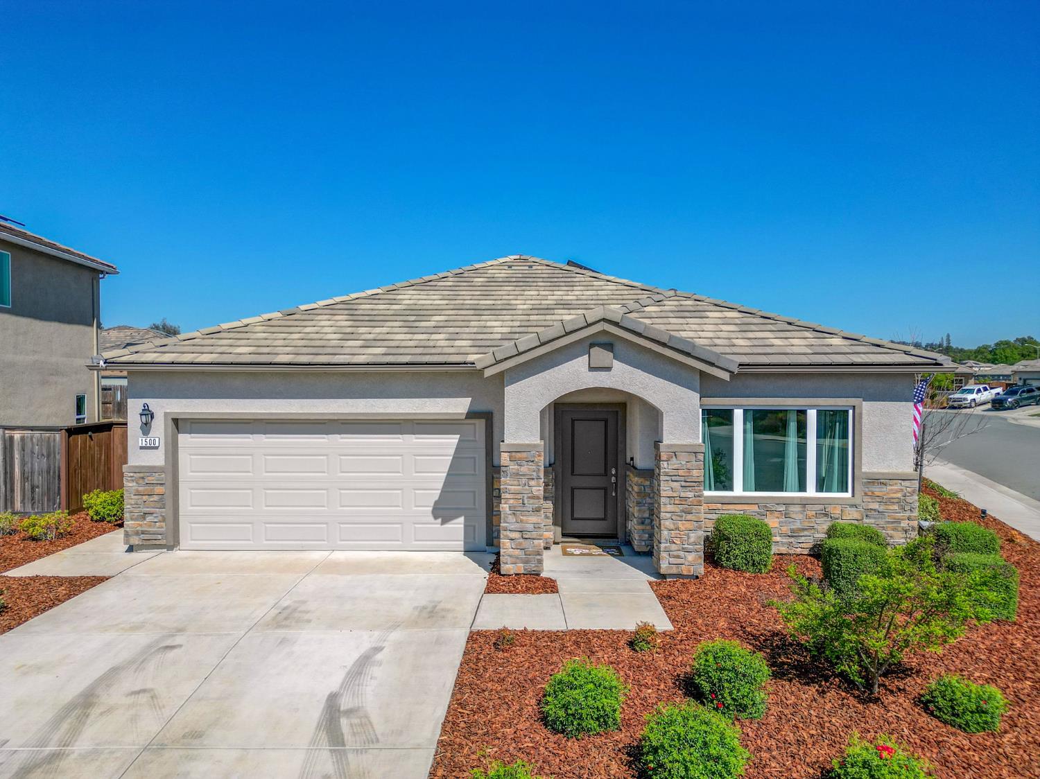1500 Lahonton Way Ione, CA 95640 - Photo 1 of 52 a front view of a house with a garage