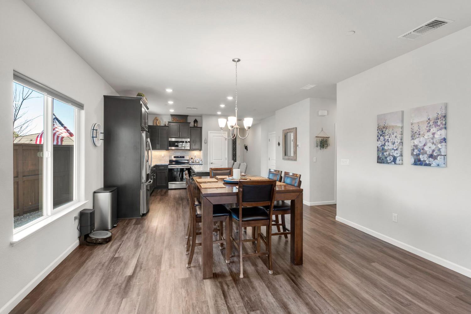 1500 Lahonton Way Ione, CA 95640 - Photo 11 of 52 a view of a dining room with furniture window and wooden floor