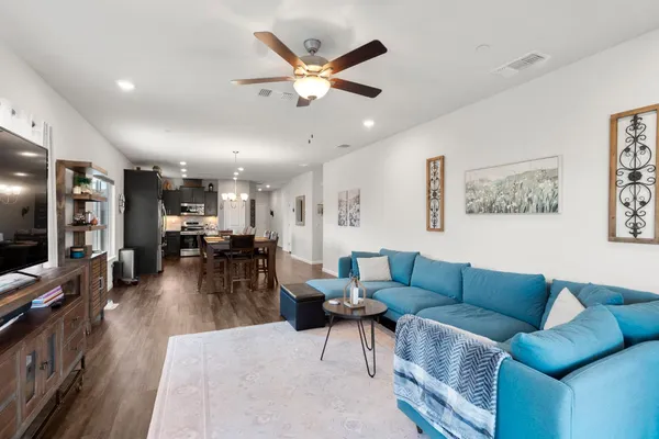 a living room with furniture and a large window