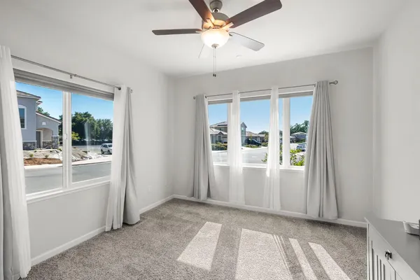 a view of kitchen with stainless steel appliances a refrigerator and a stove top oven