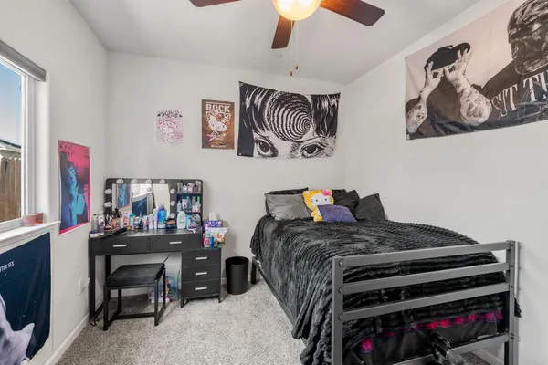 a bedroom with a bed and flat screen tv