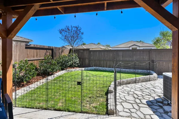 an aerial view of a swimming pool and outdoor seating