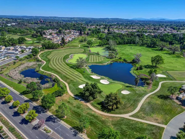 an aerial view of a house with outdoor space swimming pool