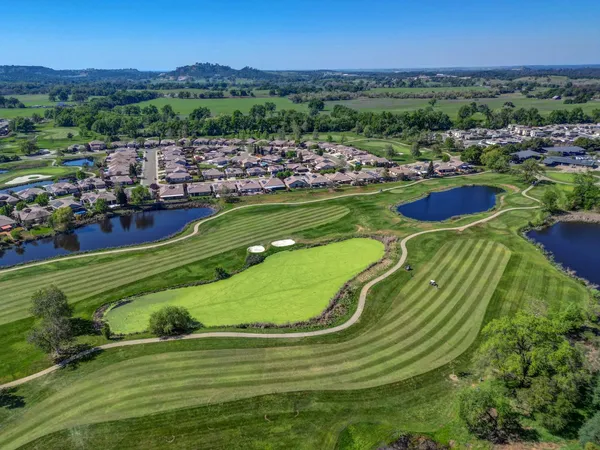a view of a backyard with sitting area
