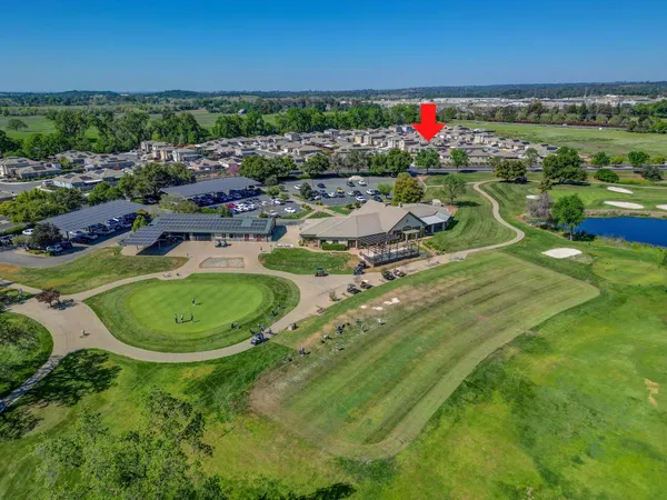 a view of a back yard of the house and a chair