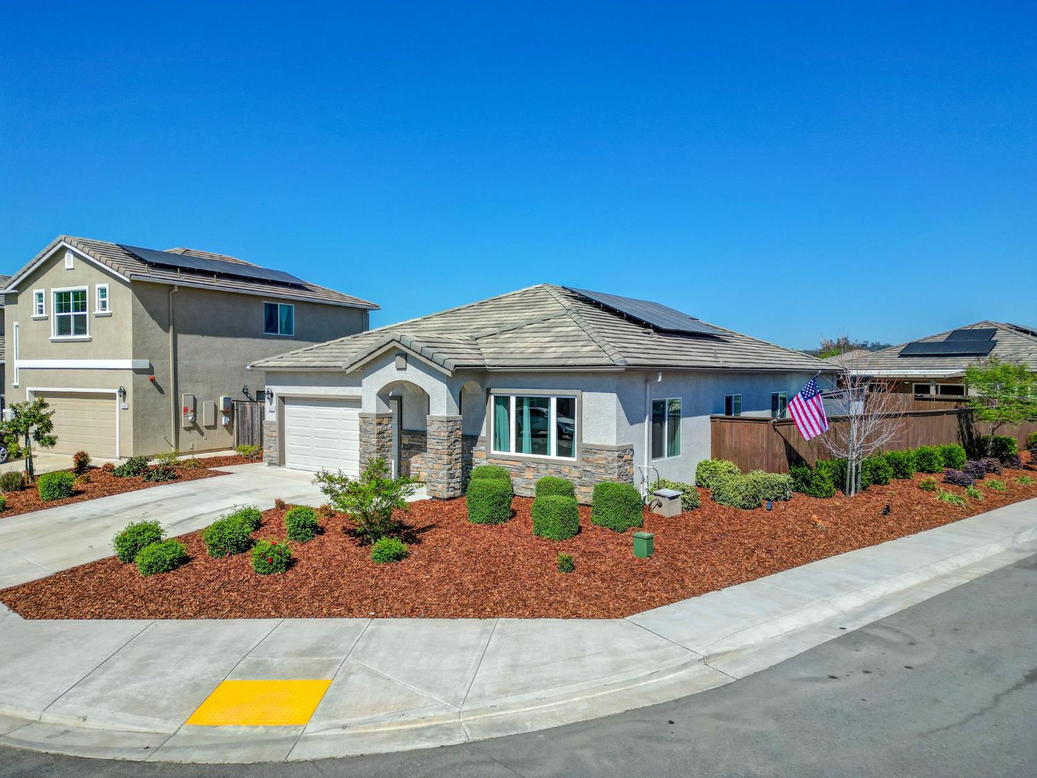 1500 Lahonton Way Ione, CA 95640 - Photo 45 of 52 a front view of a house with a yard and potted plants