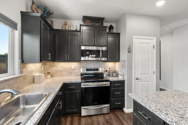 a bathroom with a sink double vanity and a mirror