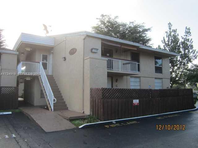 a front view of a house with stairs