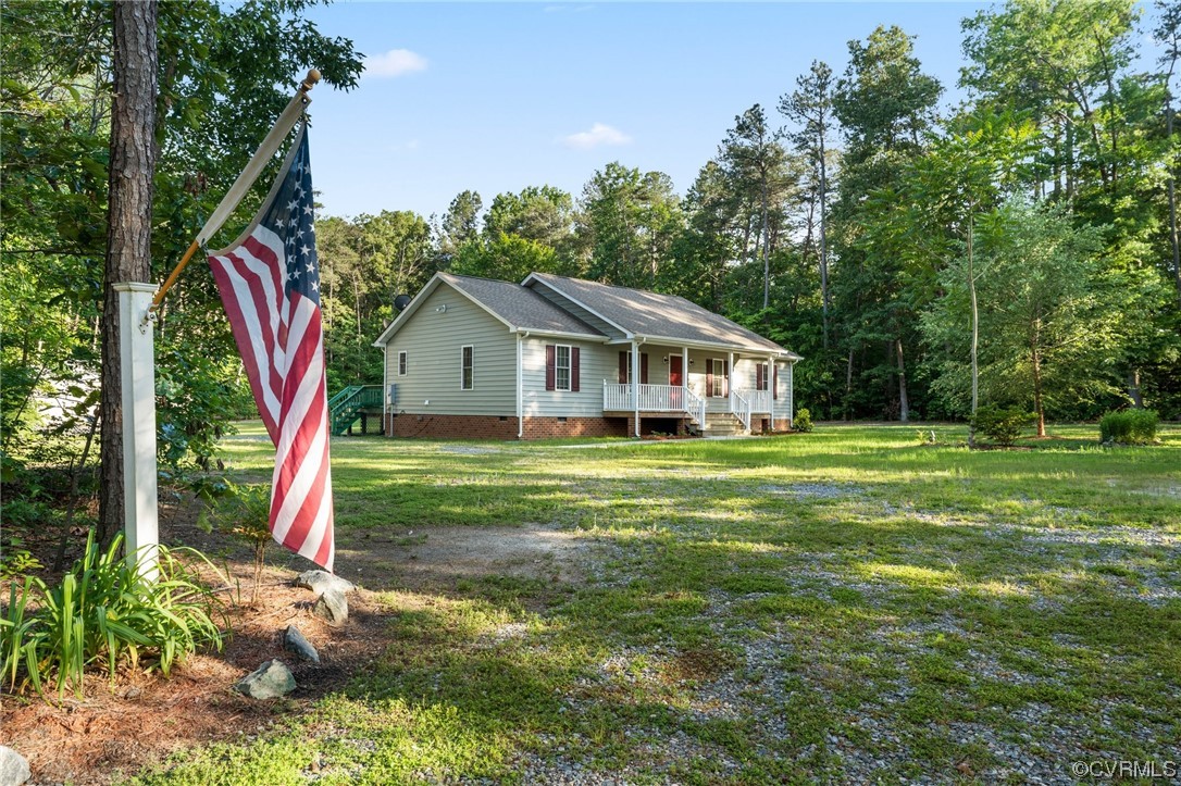 668 East Chinquapin Road King William, VA 23086 - Photo 1 of 21 a view of house with a big yard and potted plants