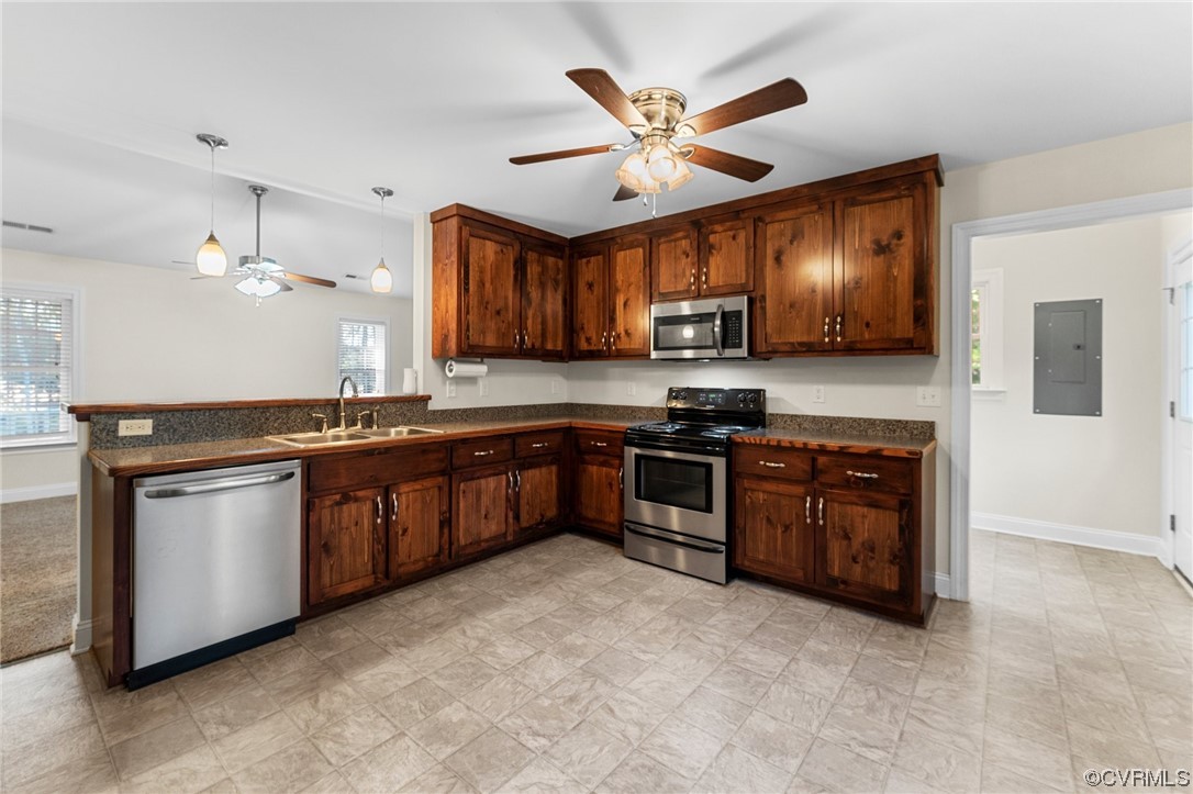 668 East Chinquapin Road King William, VA 23086 - Photo 12 of 21 a large kitchen with stainless steel appliances granite countertop a stove a sink and a refrigerator