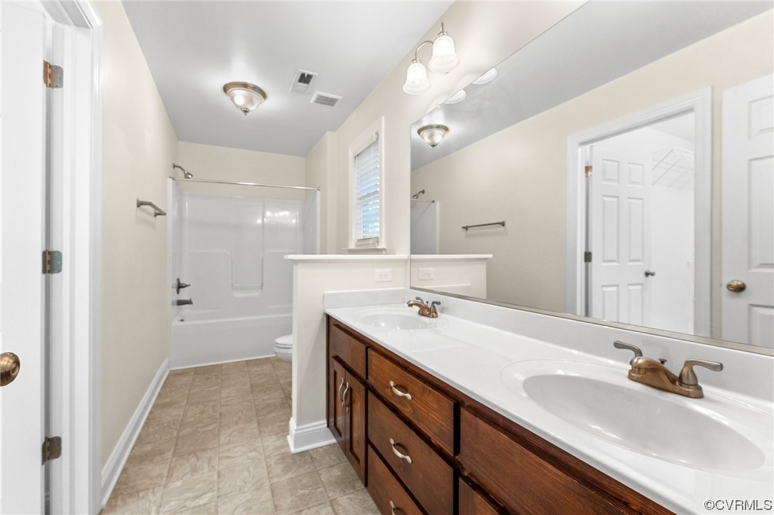 668 East Chinquapin Road King William, VA 23086 - Photo 17 of 21 a bathroom with a sink double vanity granite tub and shower