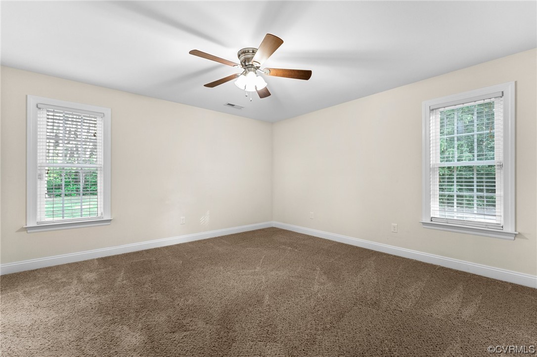 668 East Chinquapin Road King William, VA 23086 - Photo 18 of 21 an empty room with windows and fan