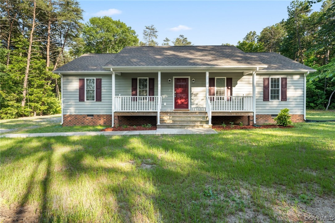 668 East Chinquapin Road King William, VA 23086 - Photo 2 of 21 a front view of a house with a yard