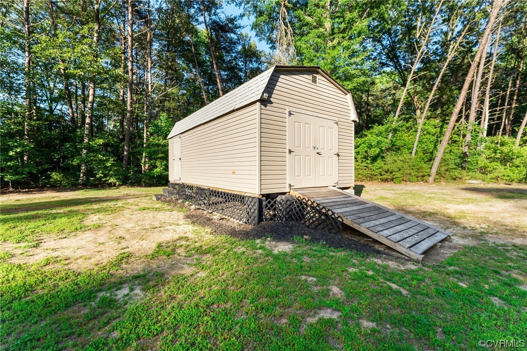 668 East Chinquapin Road King William, VA 23086 - Photo 8 of 21 a view of backyard with a garden and entertaining space