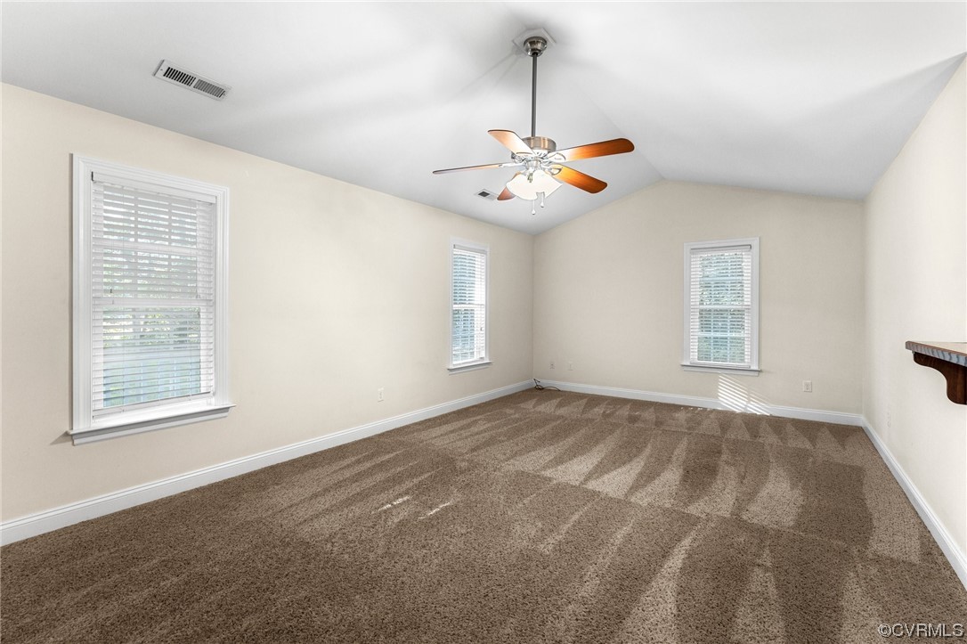 668 East Chinquapin Road King William, VA 23086 - Photo 10 of 21 a view of an empty room with chandelier and a window