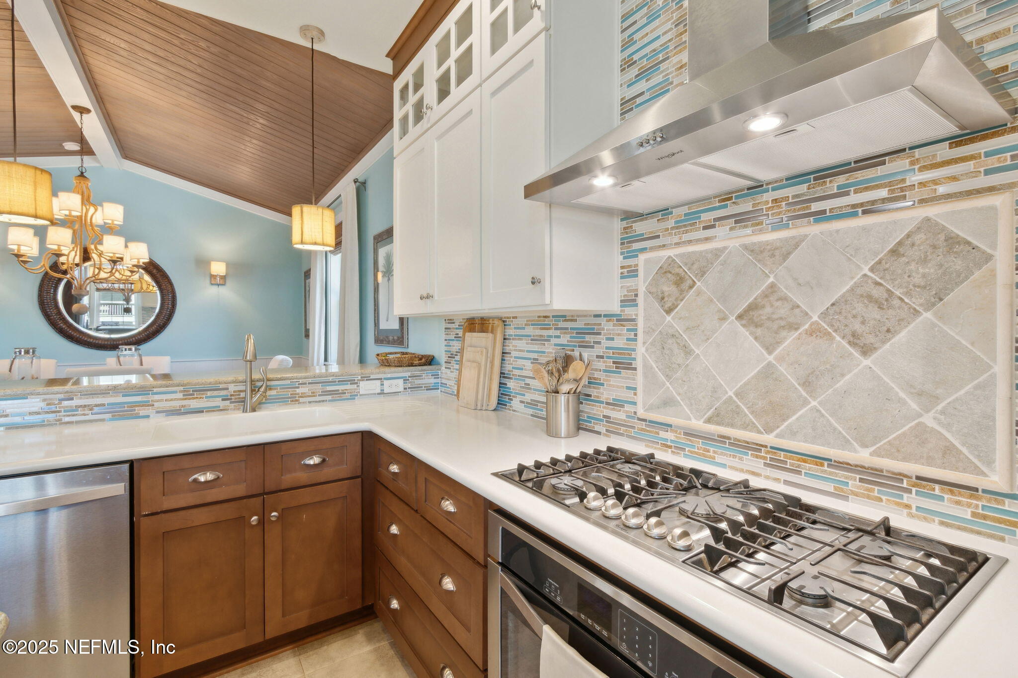 111 Cherry Street Neptune Beach, FL 32266 - Photo 18 of 62 a kitchen with a sink stove and cabinets