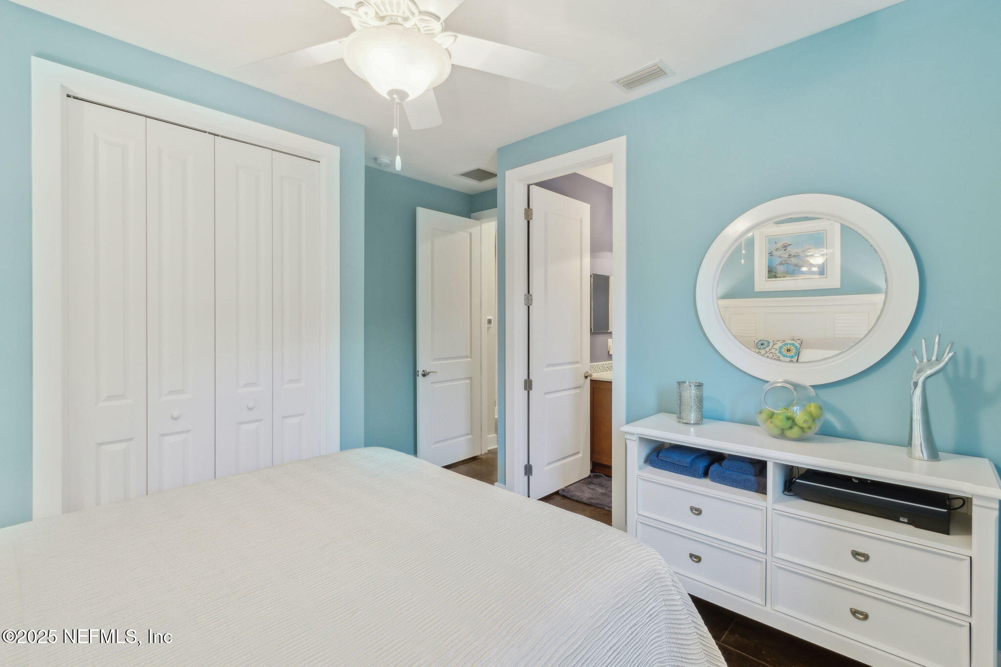 111 Cherry Street Neptune Beach, FL 32266 - Photo 43 of 62 a bedroom with a bed a dresser and potted plants