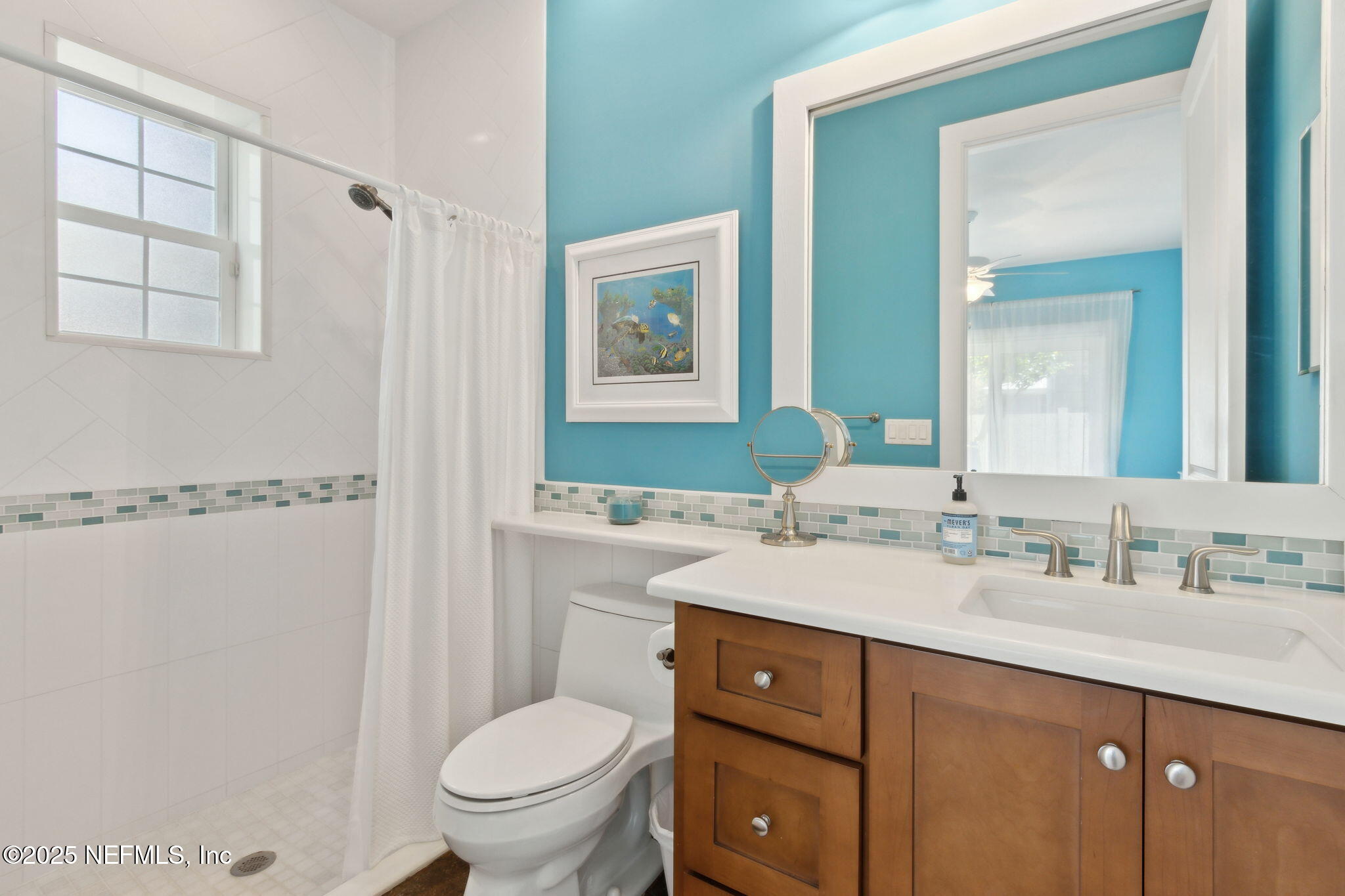 111 Cherry Street Neptune Beach, FL 32266 - Photo 47 of 62 a bathroom with a sink a toilet and shower