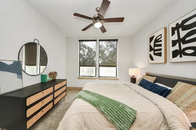 a view of a building with garden and sitting area