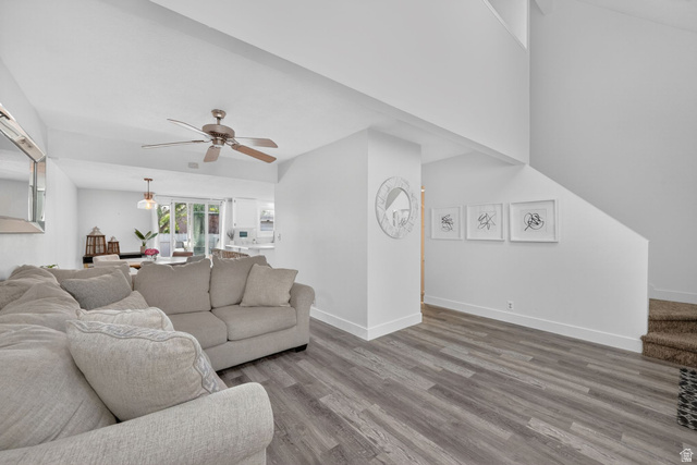 788 East Gables Street Midvale, UT 84047 - Photo 3 of 24 Open-concept living space featuring , a ceiling fan, and high vaulted ceilings