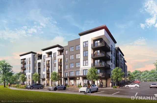 a kitchen with stainless steel appliances wooden floors stove and microwave