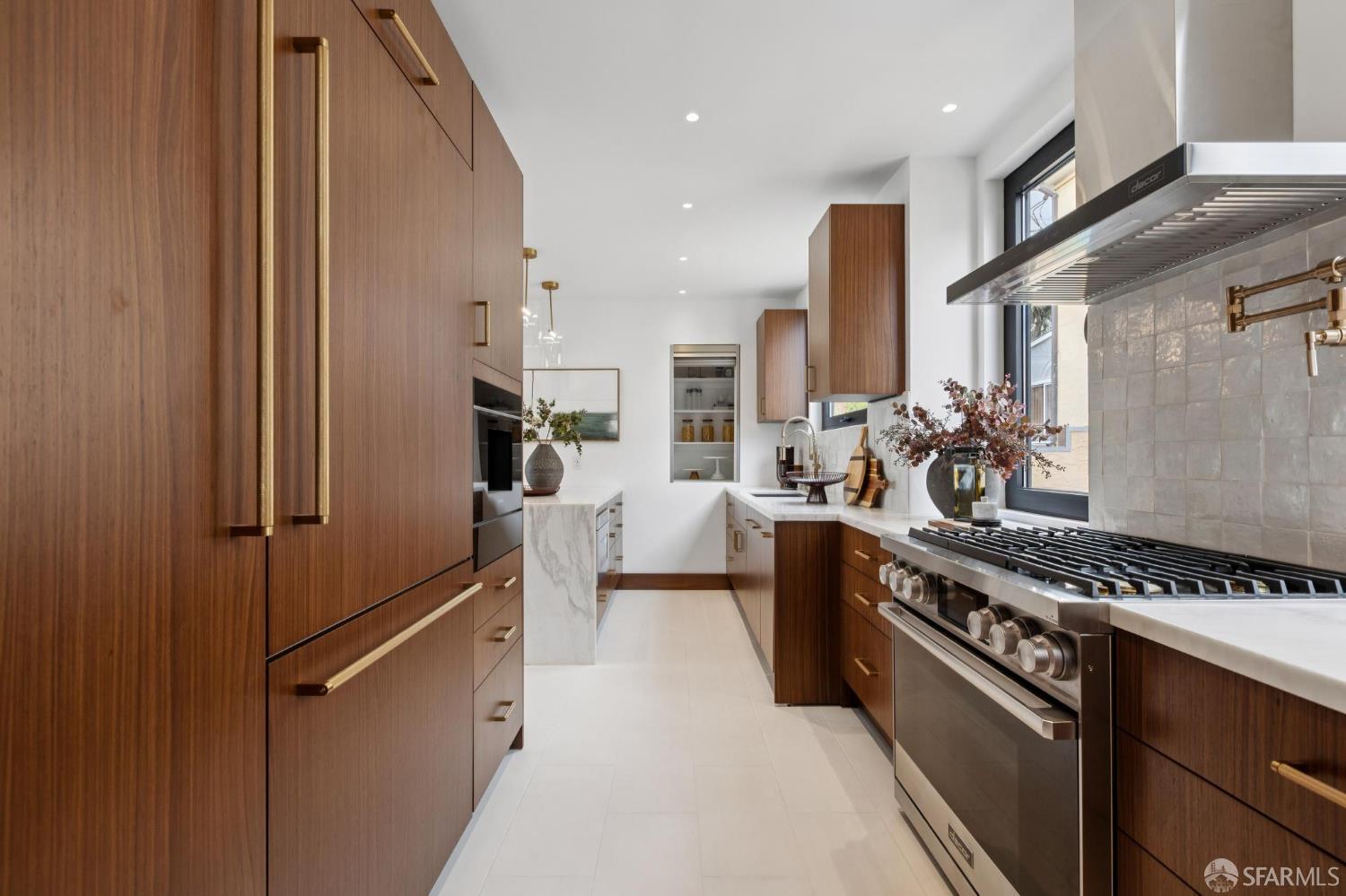 71 Manor Drive San Francisco, CA 94127 - Photo 14 of 51 a kitchen with stainless steel appliances a refrigerator a stove and white cabinets
