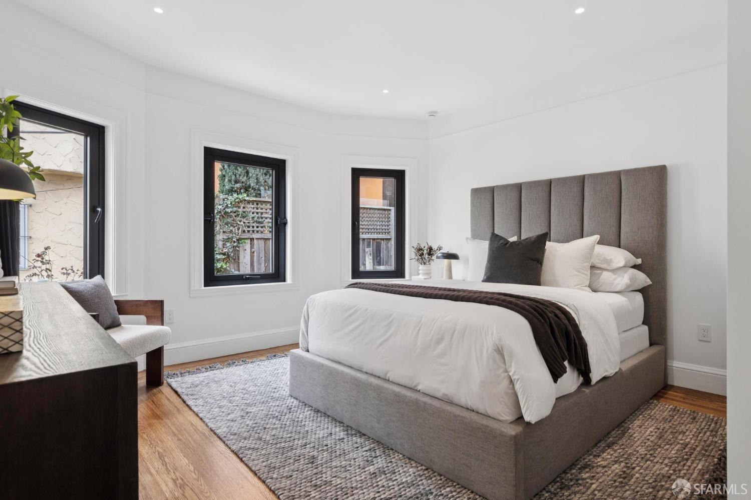 71 Manor Drive San Francisco, CA 94127 - Photo 28 of 51 a spacious bedroom with a bed and wooden floor