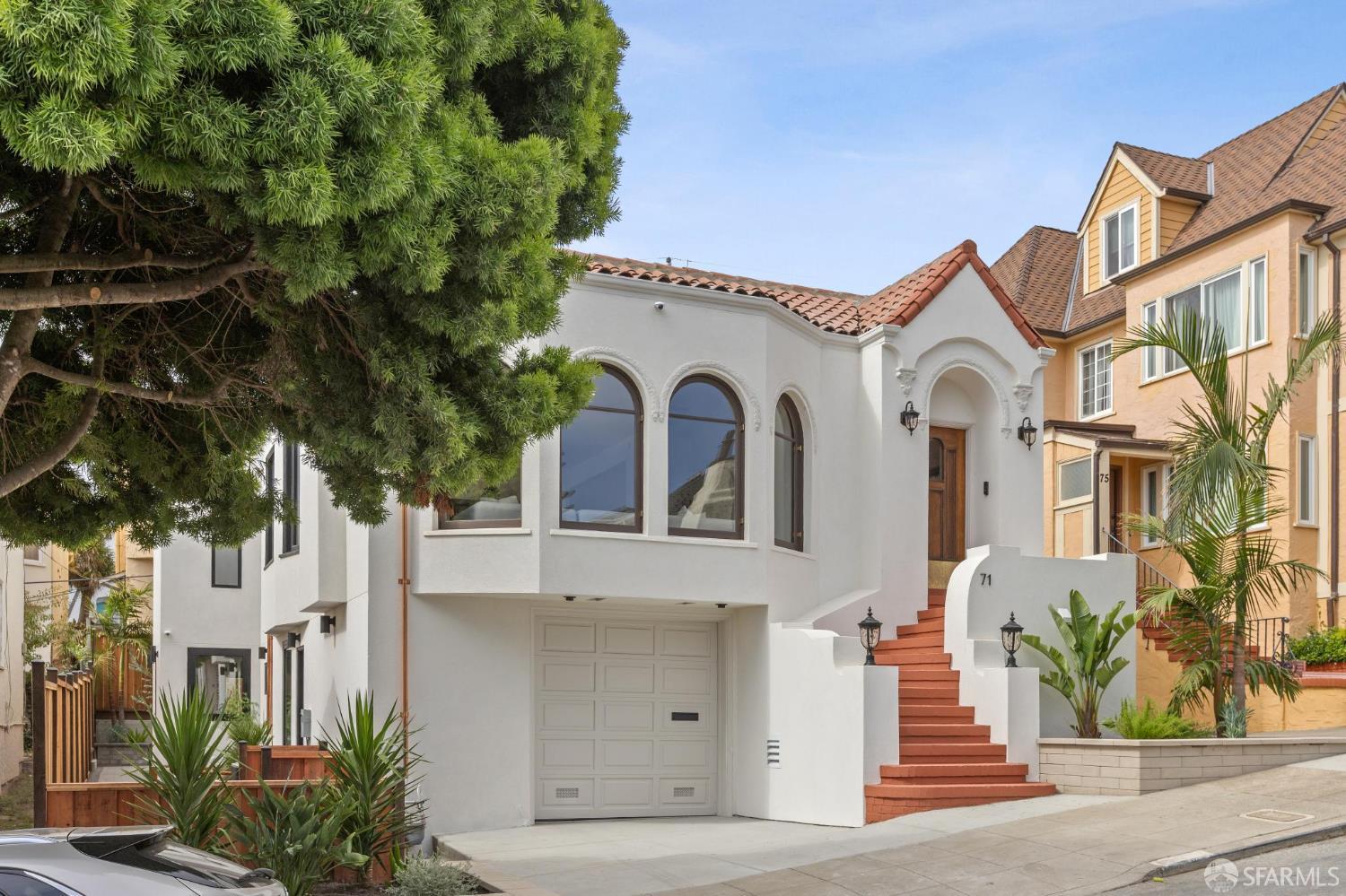 71 Manor Drive San Francisco, CA 94127 - Photo 4 of 51 a view of a white house with a tree and plants